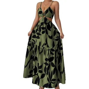 Elegant summer green maxi dress featuring black leaf print and waist cut-outs for vacation
