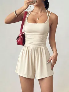 Elegant beige summer halter romper featuring a ruched tube top and wide-leg shorts