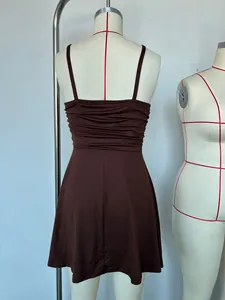 Detailed back view of a brown spaghetti strap mini dress with ruched bodice design