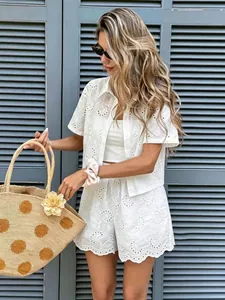 White eyelet crochet two-piece set featuring intricate floral embroidery for summer