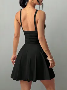 Detailed back view of a sexy black backless halter mini dress with a flared skirt and slim fit