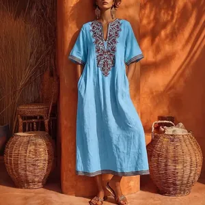 Elegant sky blue bohemian maxi dress featuring vintage V-neck and floral embroidery