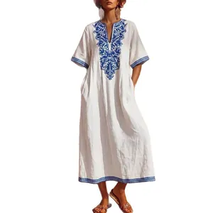 Bohemian V-neck maxi dress with intricate blue floral embroidery and a loose fit.