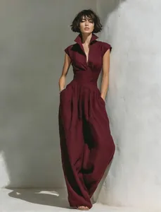 Full view of elegant burgundy sleeveless wide-leg jumpsuit with v-neck and high collar design