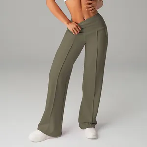 Detail view of olive green high-waisted wide-leg yoga pants with a fold-over waistband
