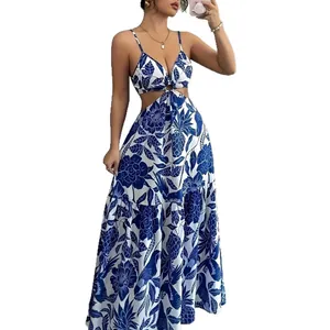 Elegant blue and white floral maxi dress with waist cutouts and ring detail for summer.