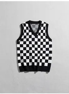 Stylish black and white checkered knit sweater vest with a classic V-neck design