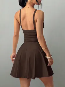 Back view of sexy dark brown backless mini dress with elegant suspender straps