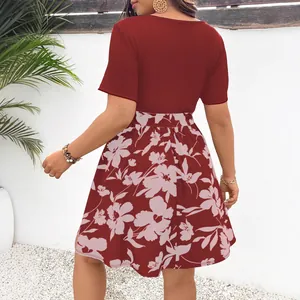 Back view of a plus-size spliced dress featuring a dark red ribbed top and floral skirt.