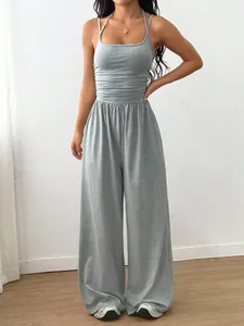 Detail view of a grey summer casual sleeveless wide-leg jumpsuit with halter neck.