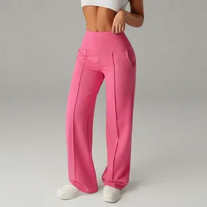 High-waisted wide-leg pink yoga pants for women with pockets and seam detail