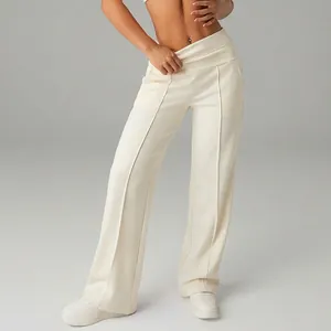 Detail view of women's cream high-waisted wide-leg loose sports trousers for athletic wear