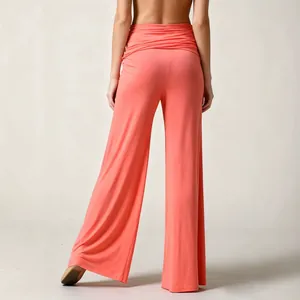 Women's high-waist wide-leg yoga pants in coral pink, back view, soft leisure flare trousers.
