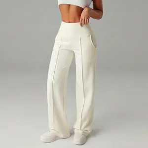 Elegant high-waisted cream wide-leg sports trousers with vertical seam detail for women.