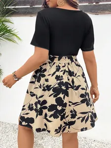 Back view of a plus size patchwork floral print dress with a black ribbed knit top