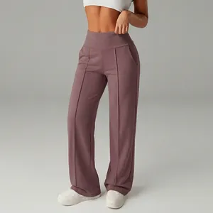 Close-up view of high-waisted wide-leg athletic pants in dusty rose for women's fitness