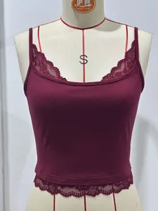 Close-up detail of burgundy camisole featuring delicate lace trim on hem and neckline