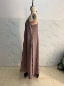 Side profile detail of a solid mauve sleeveless cami maxi dress on a garment mannequin