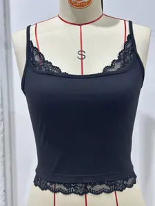 Close-up detail of a black cropped camisole with delicate lace trim on the hem