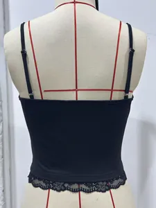 Detail view showing the back of a black slim-fit camisole with delicate lace trim detail.