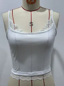 Close-up detail of white slim-fit cropped camisole with delicate lace trim
