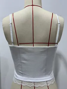 Detailed back view of a white cropped camisole featuring delicate lace trim on the hem