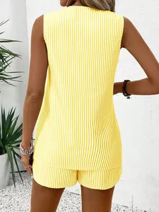 Back view of yellow and white vertical striped sleeveless top and high waist shorts set