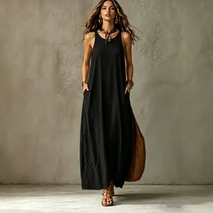 Elegant black sleeveless maxi dress with side pockets for a chic boho summer look