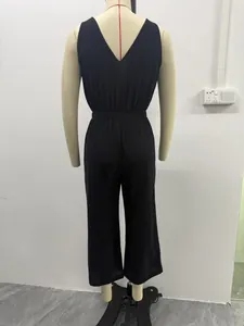 Back view of a black cotton linen V-neck sleeveless wide-leg jumpsuit on a mannequin.