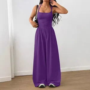 Modern deep purple sleeveless halter neck wide-leg jumpsuit for a stylish summer casual look