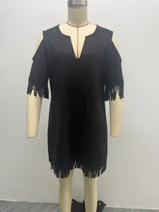 Front view of a black faux suede dress with fringe details displayed on a dress form mannequin