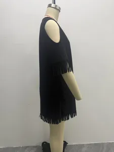 Side detail view of a black suede fringe dress featuring stylish cold shoulder cutouts.