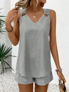 Close-up detail of stylish striped V-neck vest and matching shorts set with metal ring accents
