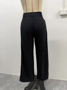 Rear view of black high-waisted wide-leg suit trousers on a mannequin.