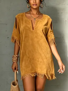 Detailed view of mustard suede dress with fringe hem and cold shoulder cut-outs