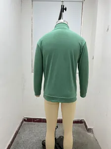 Detailed back view of a green long-sleeved men's casual half-zip pullover on a mannequin.