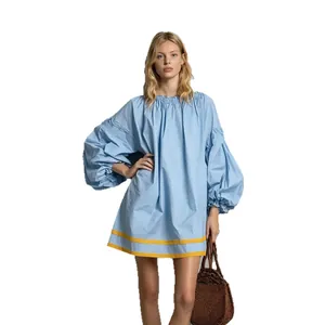 Elegant light blue loose baby doll dress featuring bubble sleeves and contrast yellow stripes