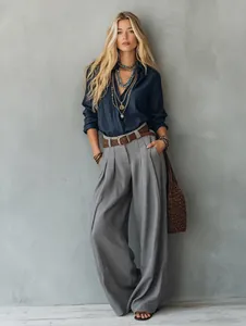 Full-length detail of grey high-waisted wide-leg trousers for a chic professional look