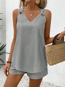 Detail of striped sleeveless top with V-neck and metal rings, paired with high-waist shorts.