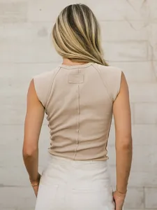 Detailed back view of a slim fit beige ribbed knit sleeveless tank top for women.