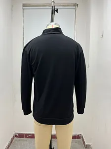 Back view of a minimalist black long-sleeved men's casual polo shirt on a mannequin