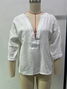 Detailed view of casual white women's long-sleeve blouse with V-neck on a dress form