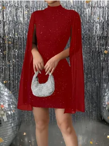Detail of elegant red bodycon dress with chiffon cape sleeves and sparkling pearl accents