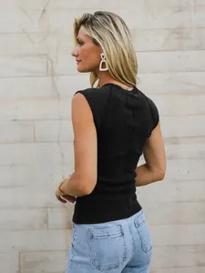 Back view detail of a black slim-fit sleeveless ribbed knit top on a blonde model.