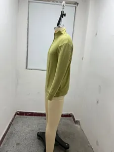 Detailed side profile of a men's lime green long-sleeve quarter-zip knit polo shirt