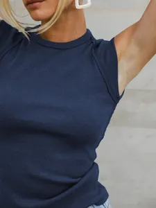 Close-up of navy blue ribbed knit sleeveless top showing texture and slim fit design