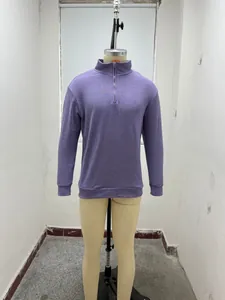 Detailed view of men's casual purple long-sleeved quarter-zip polo sweater on a tailor mannequin