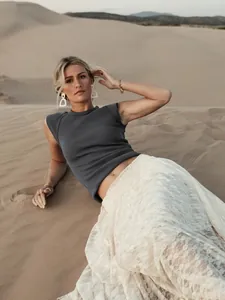 Stylish sleeveless ribbed knit top for women in charcoal grey with desert backdrop