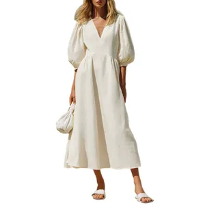 Elegant white V-neck puff sleeve midi dress with cinched waist, perfect for summer vacation