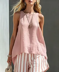 Detail of pink sleeveless linen top with textured fabric and relaxed summer style